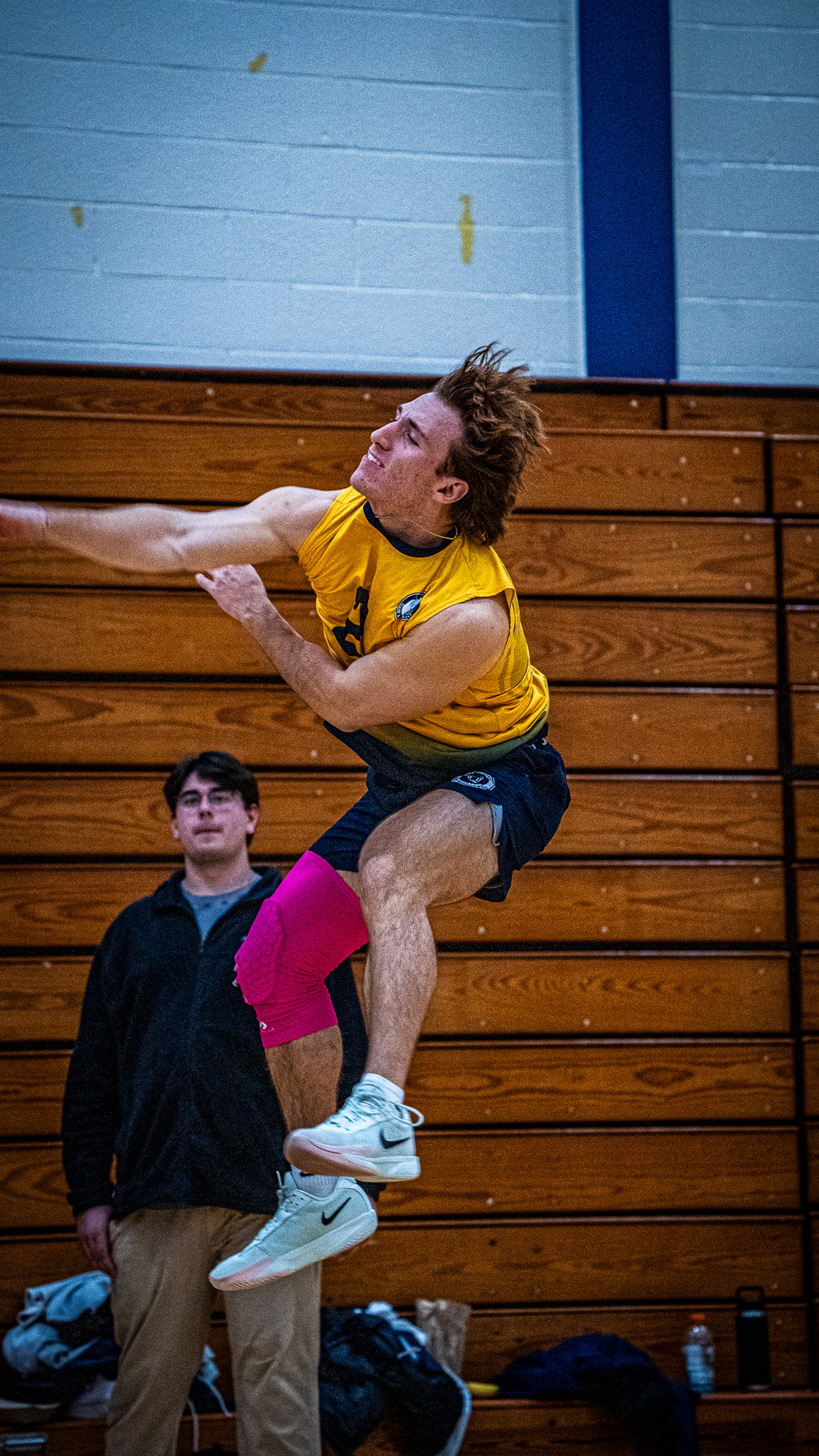 Adam attacking a volleyball